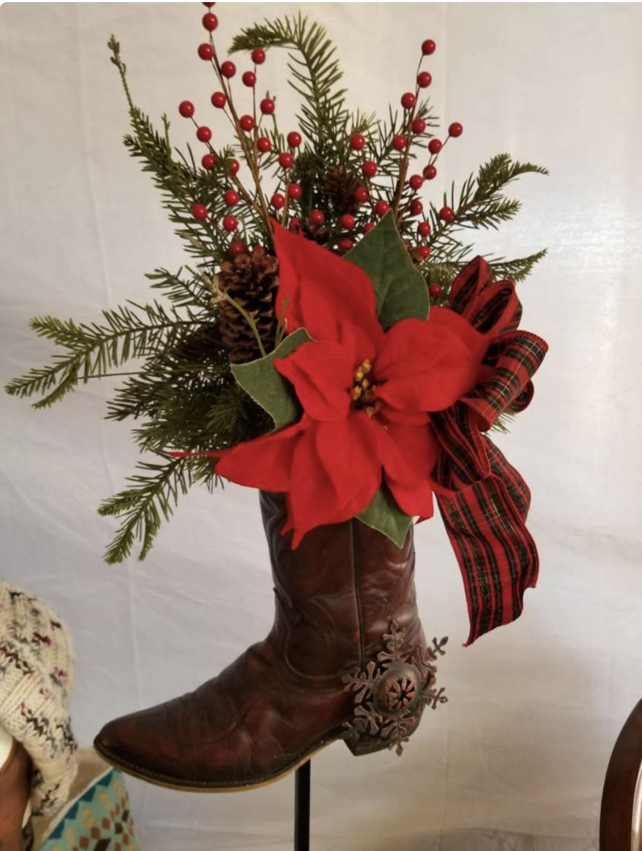 Brown cowboy boot poinsettia arrangement